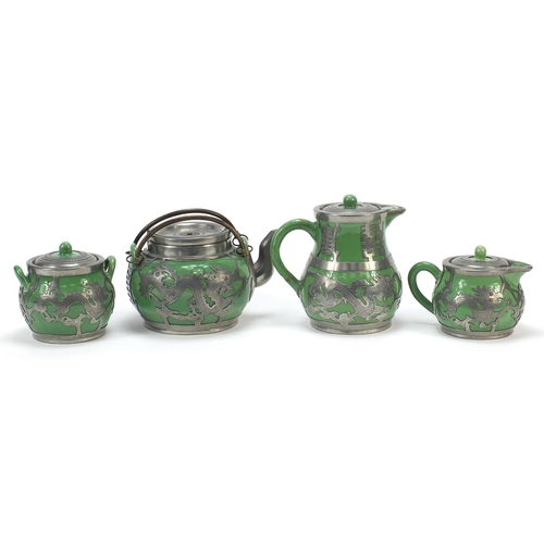 240 - Chinese pewter mounted pottery four piece tea set comprising two jugs, sugar bowl and teapot, the pe... 