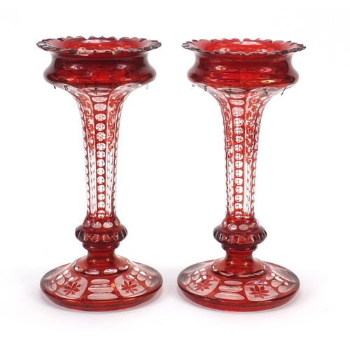 297 - Pair of Bohemian ruby flashed cut glass lustre vases, each 28cm high