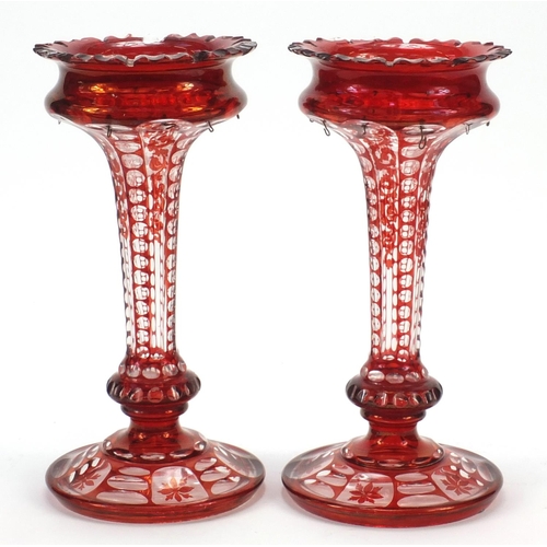 297 - Pair of Bohemian ruby flashed cut glass lustre vases, each 28cm high