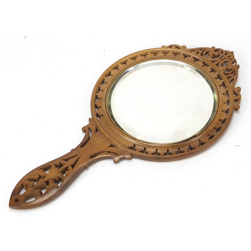 198 - Italian Sorrento ware hand mirror inlaid with three peasants, 33cm in length