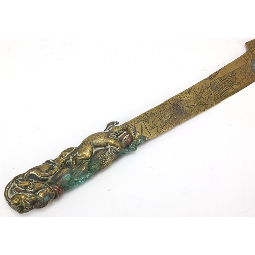 70 - Japanese mixed metal bronzed letter opener and a vesta case embossed with birds amongst trees, the l... 