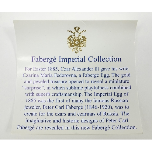 40 - Set of four Fabergé Collection menu holders housed in a fitted silk and velvet lined case, each menu... 