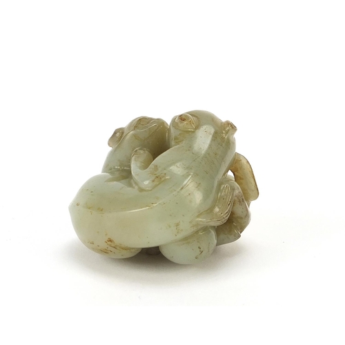 72 - Good Chinese celadon and russet jade carving of two mythical animals, 4.5cm wide