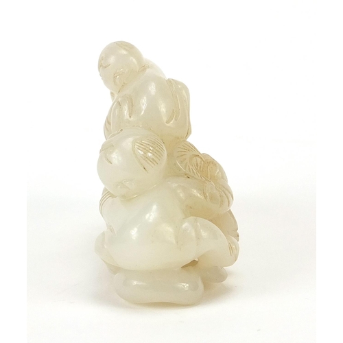 76 - Chinese white jade carving of two boys and peaches, 8cm wide