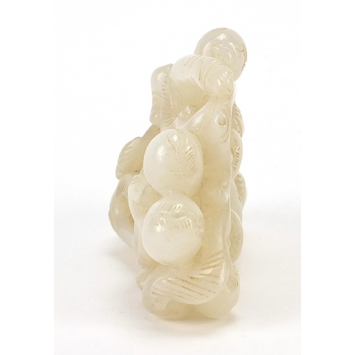 76 - Chinese white jade carving of two boys and peaches, 8cm wide