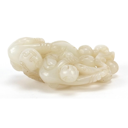 76 - Chinese white jade carving of two boys and peaches, 8cm wide