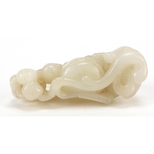 76 - Chinese white jade carving of two boys and peaches, 8cm wide