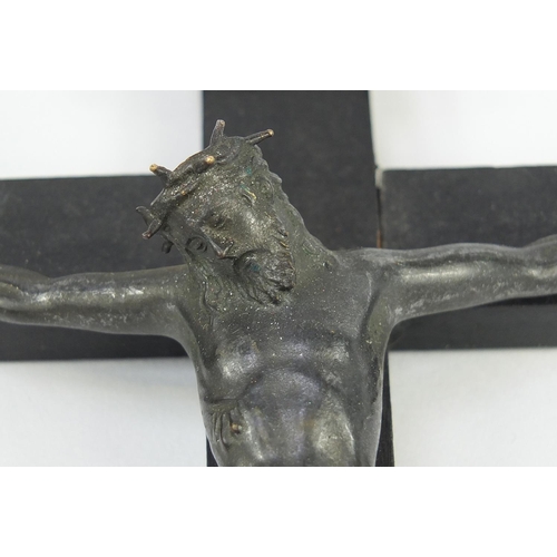 139 - Two religious crucifixes each with applied bronzed Christ, the largest 50cm high