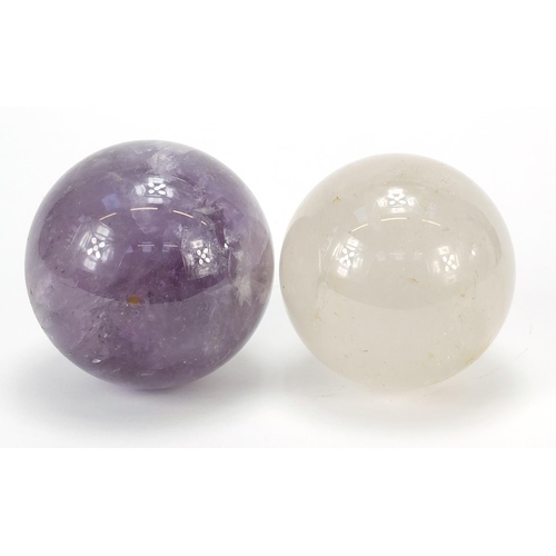 152 - Two fortune teller's crystal balls including an amethyst example, the largest 10.5cm in diameter