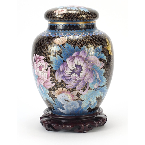 65 - Large Chinese cloisonné ginger jar and cover enamelled with flowers, raised on a carved hardwood sta... 