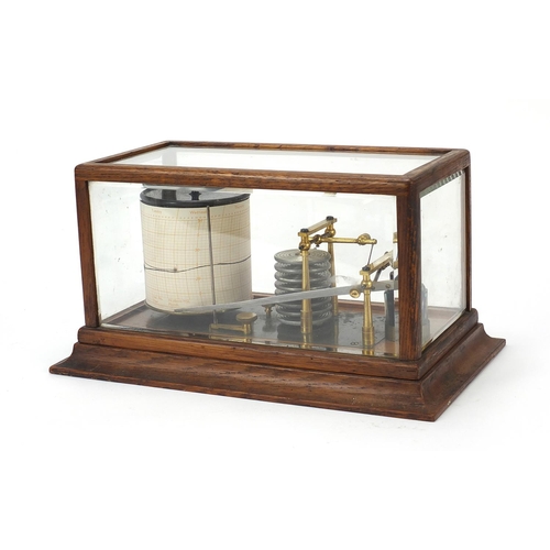 8 - Victorian eight ring barograph with charts housed in a glazed oak case, 18cm H x 35cm W x 20cm D