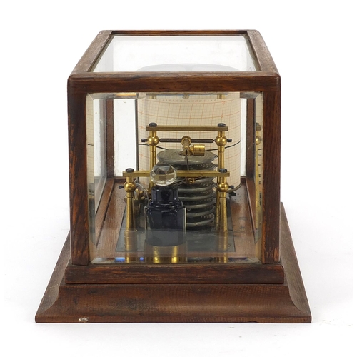 8 - Victorian eight ring barograph with charts housed in a glazed oak case, 18cm H x 35cm W x 20cm D