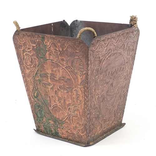 107 - Arts & Crafts copper waist paper basket with Oriental  faces, 30cm H x 27cm W x 27cm D