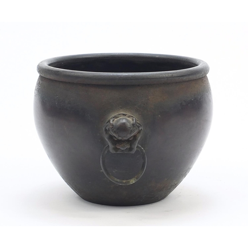 242 - Chinese patinated bronze censer with animalia ring turned handles, character marks to the base, 13.5... 