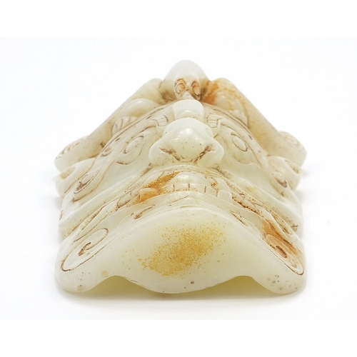 246 - Chinese russet jade carving of a face mask, 18cm high