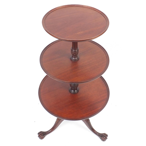 1634 - Mahogany three tier dumb waiter with ball and claw feet, 110cm high, the largest tier 55cm in diamet... 