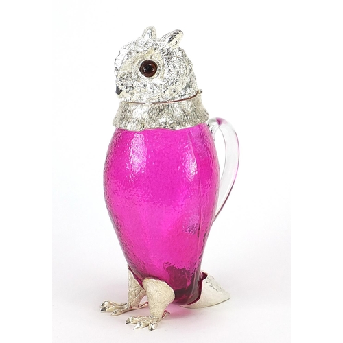 689 - Novelty cranberry glass owl jug with silver plated mounts and beaded glass eyes, 29cm high