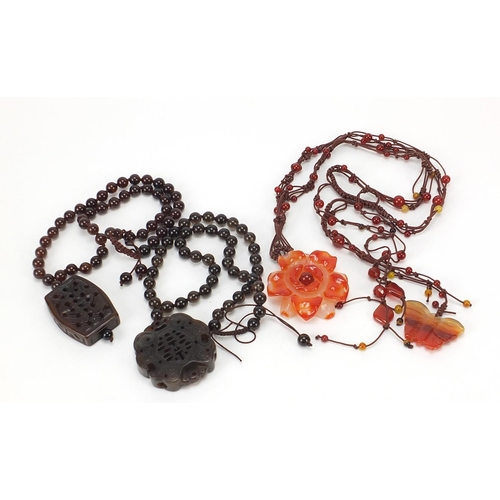 281 - Four Chinese hardstone pendant bead necklaces, the largest 60cm in length, total 206.0g