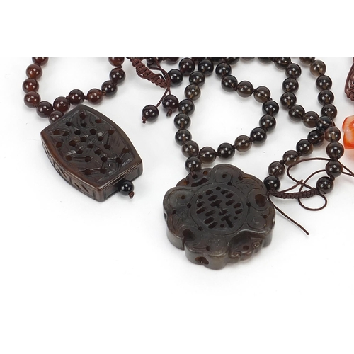 281 - Four Chinese hardstone pendant bead necklaces, the largest 60cm in length, total 206.0g