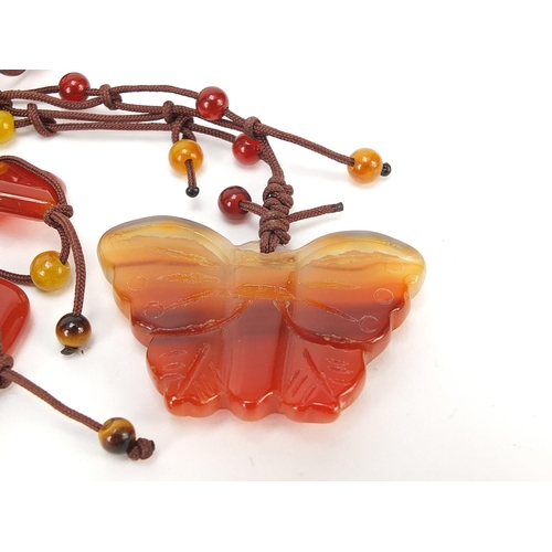 281 - Four Chinese hardstone pendant bead necklaces, the largest 60cm in length, total 206.0g