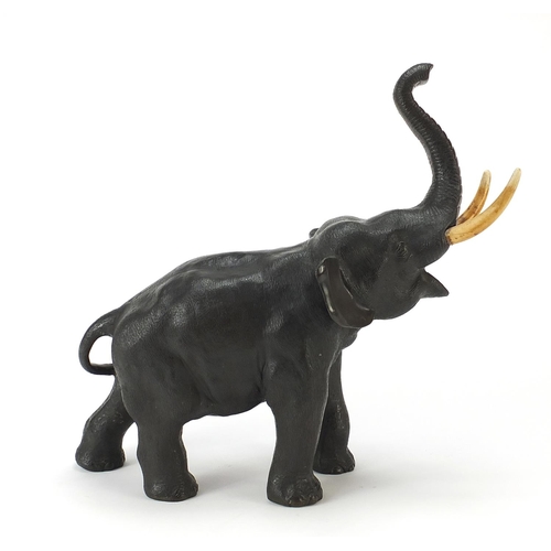 68 - Large Japanese Meiji period patinated bronze elephant with ivory tusks, three figure character marks... 