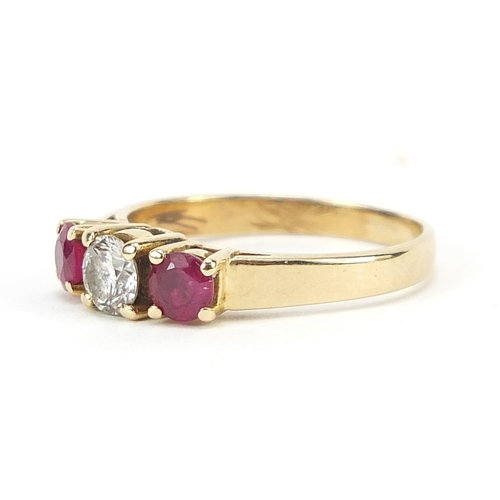 79 - 14ct gold diamond and ruby three stone ring, the diamond approximately 4.3mm in diameter, size N, 2.... 