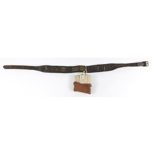 1453 - British military leather belt with cap badges, buttons and ARP first aid pouch, the belt 94.5cm in l... 