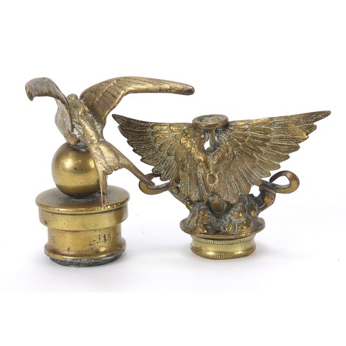 133 - Two antique brass car mascots including one in the form of a swallow, the largest 14cm high