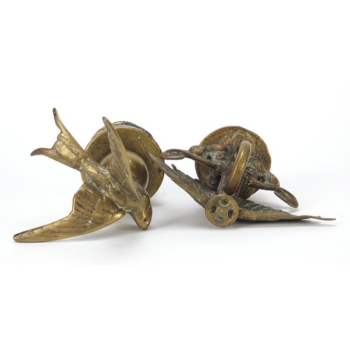 133 - Two antique brass car mascots including one in the form of a swallow, the largest 14cm high