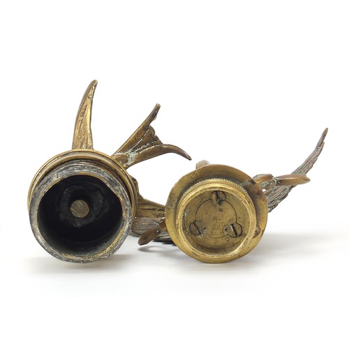 133 - Two antique brass car mascots including one in the form of a swallow, the largest 14cm high