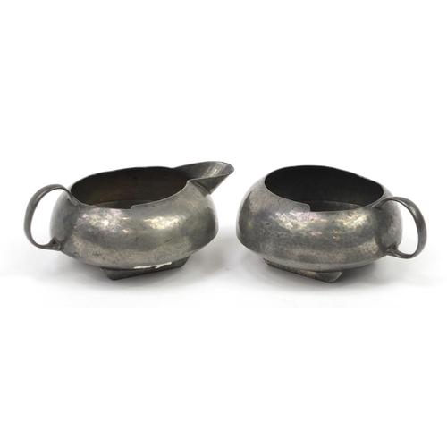 102 - Archibald Knox for Liberty & Co, Arts & Crafts pewter milk jug and handled sugar bowl, each numbered... 