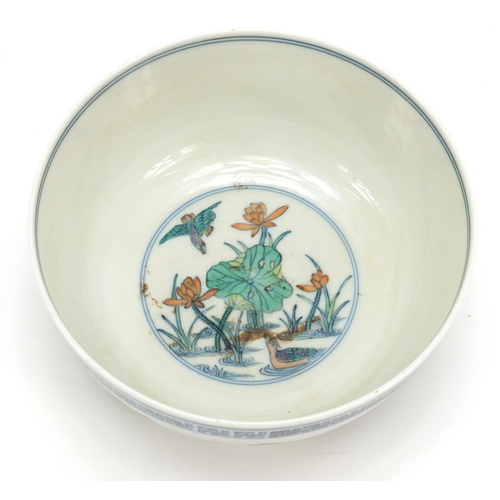 235 - Chinese doucai porcelain bowl hand painted with ducklings in water amongst lily pads and flowers, si... 