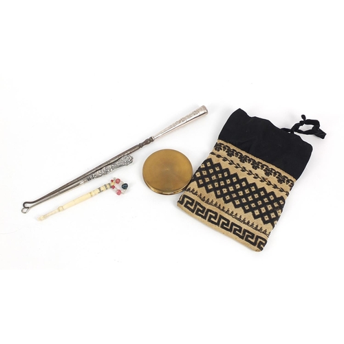 791 - Objects comprising two silver handled button hooks, beadwork miser's purse, bone bobbin and shipping... 