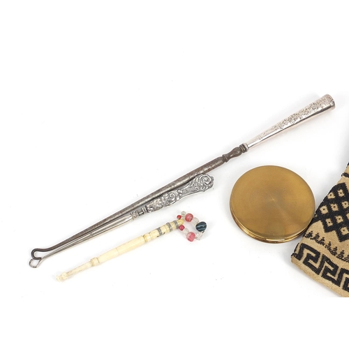 791 - Objects comprising two silver handled button hooks, beadwork miser's purse, bone bobbin and shipping... 