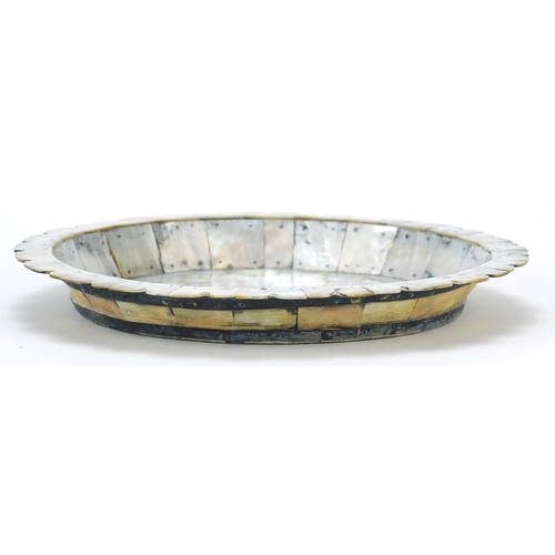 132 - Indian Goa mother of pearl plate formed of pinned sections, 22cm in diameter