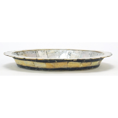 132 - Indian Goa mother of pearl plate formed of pinned sections, 22cm in diameter