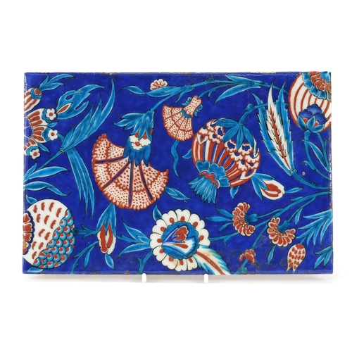 225 - Turkish Iznik tile fragment hand painted with flowers, 28.5cm x 19cm