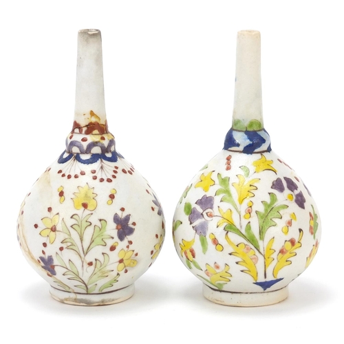 131 - Pair of Islamic rosewater sprinklers hand painted with flowers, each 15.5cm high