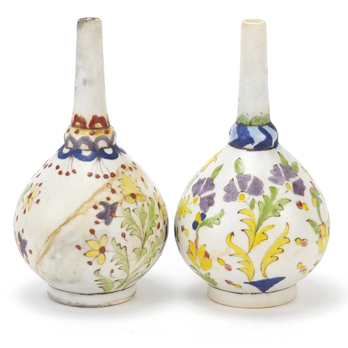 131 - Pair of Islamic rosewater sprinklers hand painted with flowers, each 15.5cm high