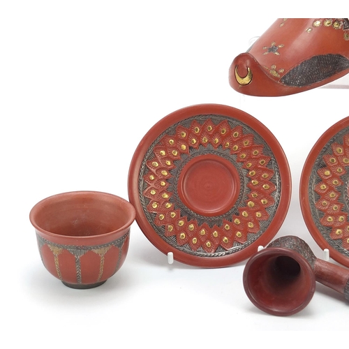 226 - Turkish Tophane terracotta comprising a slipper, two tea bowls with saucers and a pipe bowl, the lar... 