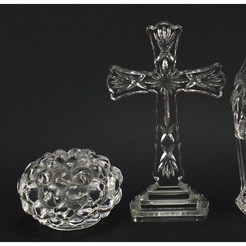 906 - Crystal glassware comprising a Waterford eight inch standing cross, Waterford figure of Madonna, Orr... 