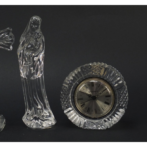 906 - Crystal glassware comprising a Waterford eight inch standing cross, Waterford figure of Madonna, Orr... 