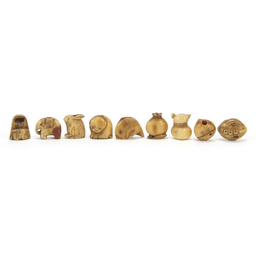 285 - Nine Japanese carved bone Ojimes including gourd vessel and fish, the largest 2cm wide