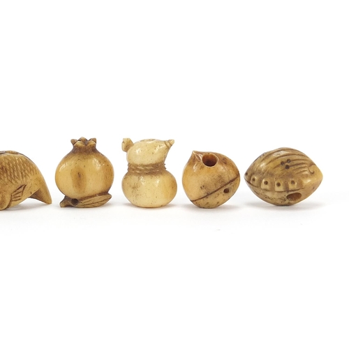 285 - Nine Japanese carved bone Ojimes including gourd vessel and fish, the largest 2cm wide