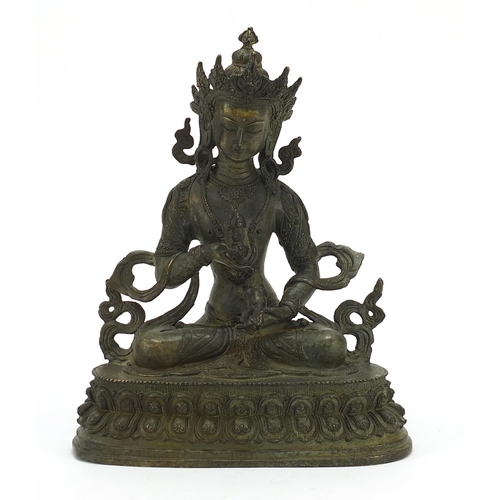 567 - Chino Tibetan patinated bronze figure of Buddha, 29cm high