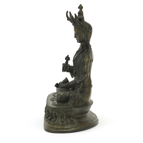 567 - Chino Tibetan patinated bronze figure of Buddha, 29cm high