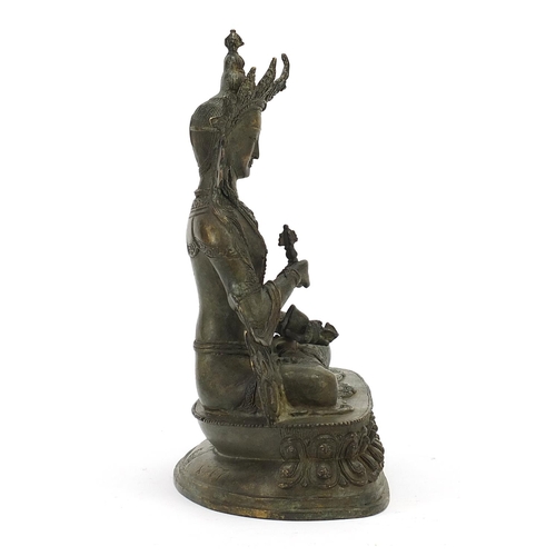 567 - Chino Tibetan patinated bronze figure of Buddha, 29cm high