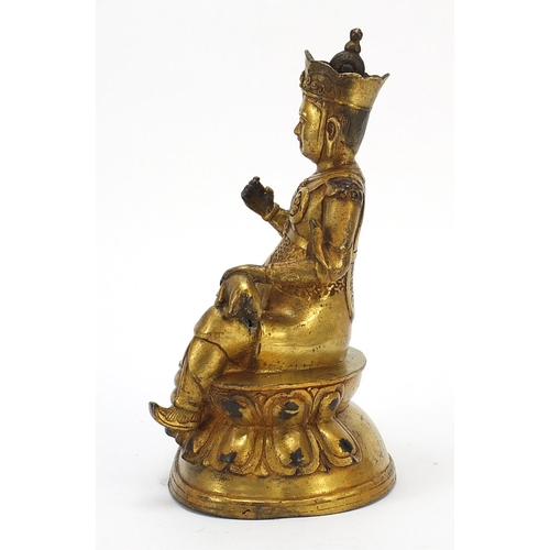 728 - Chino Tibetan gilt bronze mythical figure and animal, 26cm high