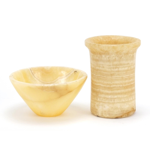 231 - Egyptian carved alabaster bowl and cylindrical vessel, the largest 12cm high