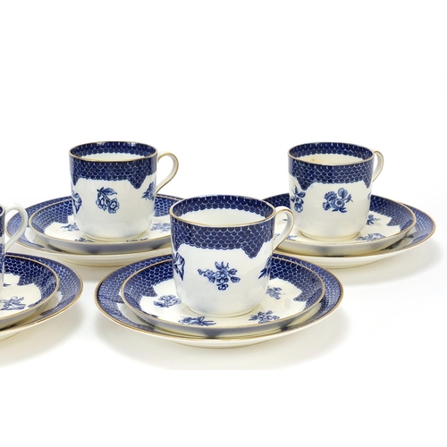 895 - Set of six Coalport blue and white trios decorated with flowers, each cup 6.5cm high